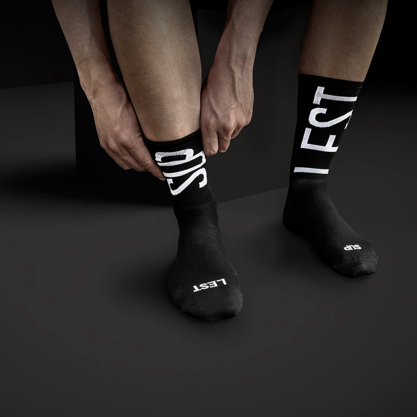 Suplest x Fingercrossed Typo Black Socks from Ascender Cycling Club in Zürich Switzerland In Context View