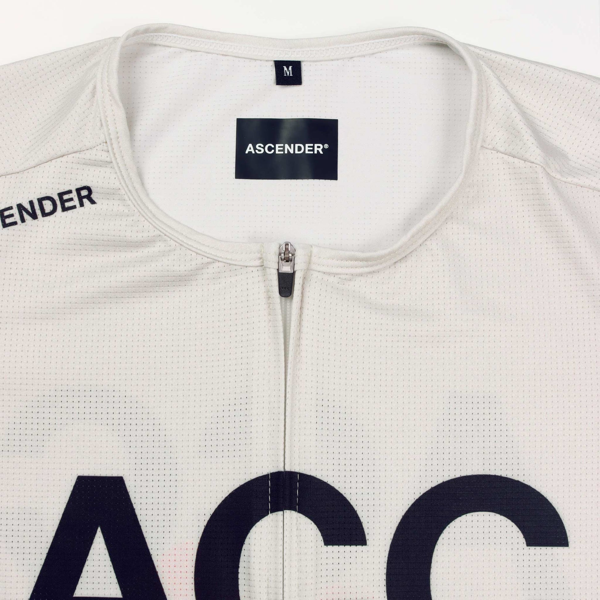 ACC Pulse short sleeve cycling jersey in Clouds Dancer with orange-red swoosh, low aero collar close-up view